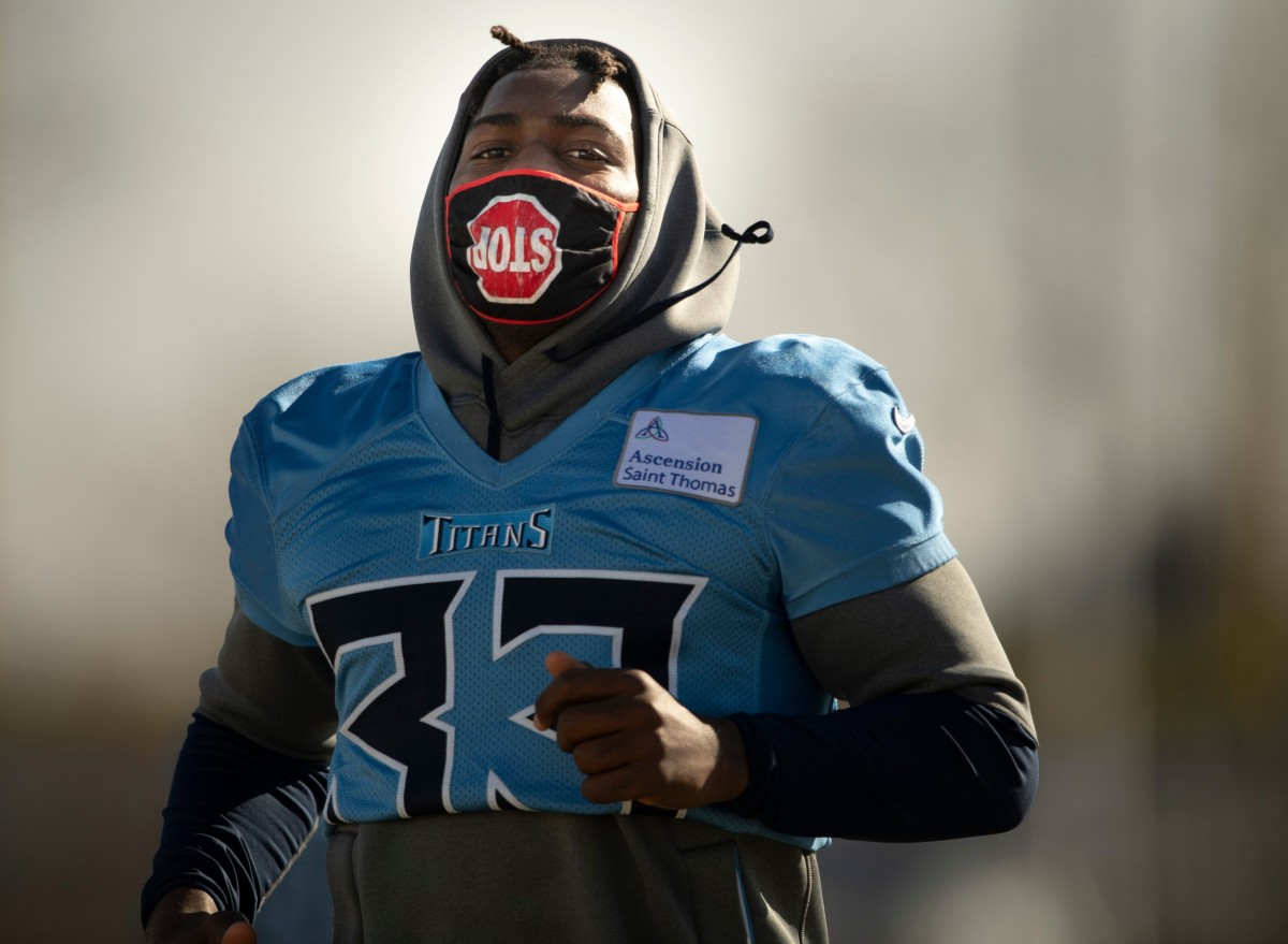 King jogs across the field during practice. 